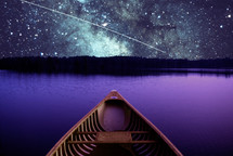 computer composed image consisting of a Mansfield 15 foot canoe on the Pamlico River in North Carolina combined with a NASA photo of the Milky Way and a meteorite.