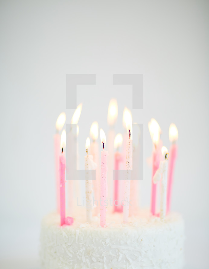 flames on candles on a birthday cake 