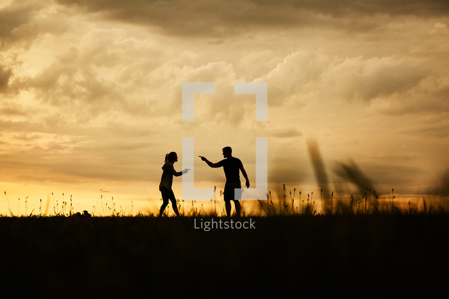 silhouettes of an arguing couple 