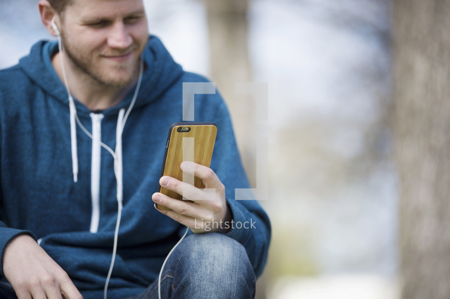 a man listening to music on his iPod 