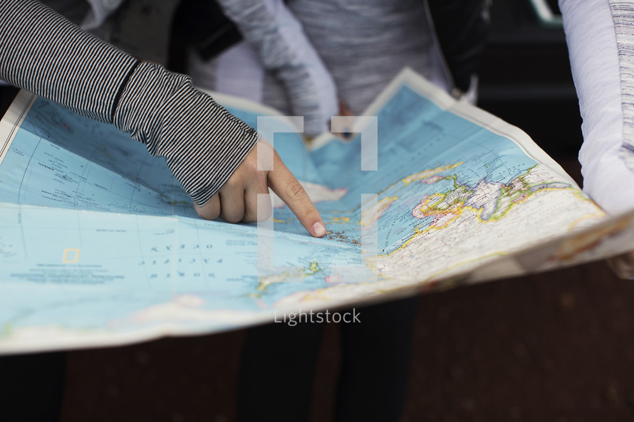 Two women looking at a map.