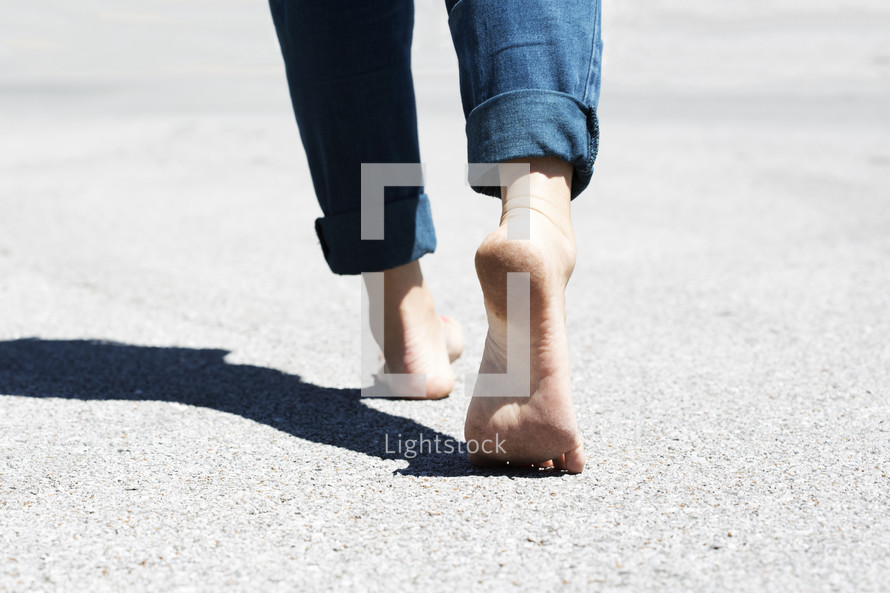 bare feet walking on concrete. 