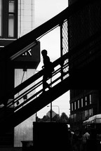 silhouette walking down a stairway 