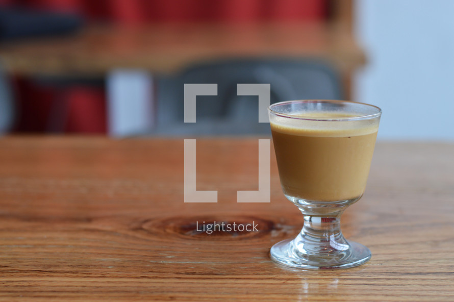 espresso shot on a wood table 