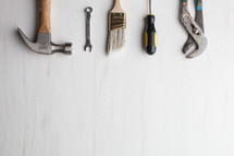 Tools lined up on a white background.