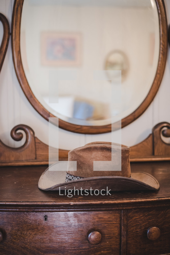 cowboy hat on dresser 