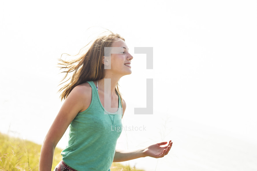 woman with hair blowing in the breeze 