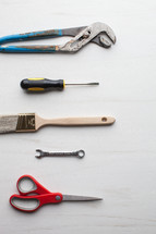 Tools lined up on a white background.