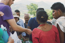 missionary passing out supplies 