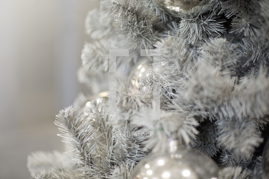 White Christmas tree with silver ornaments
