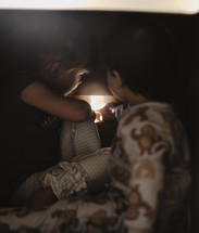 children touching a nightlight 