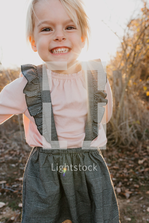 smiling little girl outdoors 