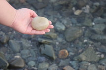 hand holding a stone 