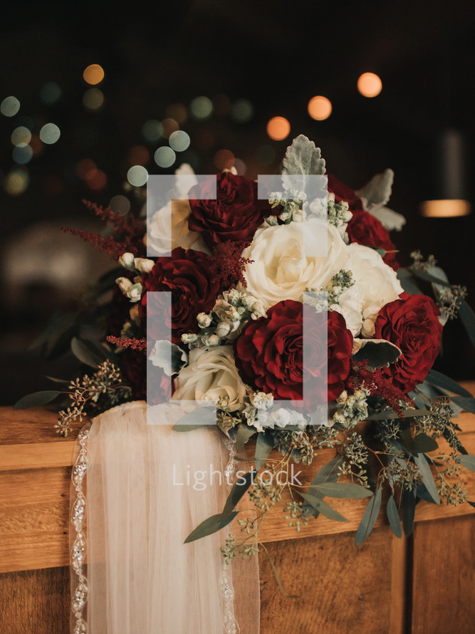 Red and white wedding flowers with veil 
