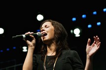 woman singing at a concert