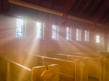 rays of sunlight shining through stained glass windows