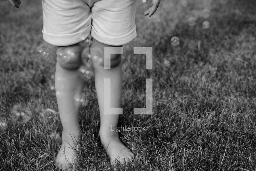 child's legs and bubbles 