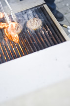 cooking hamburgers on a grill