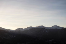 Mountain peaks lit by morning sun.