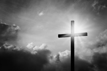 sunburst behind a cross 
