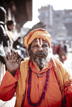 man in orange in Tibet 