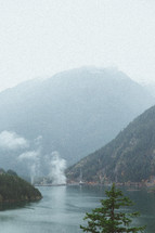fog over mountains and lake 