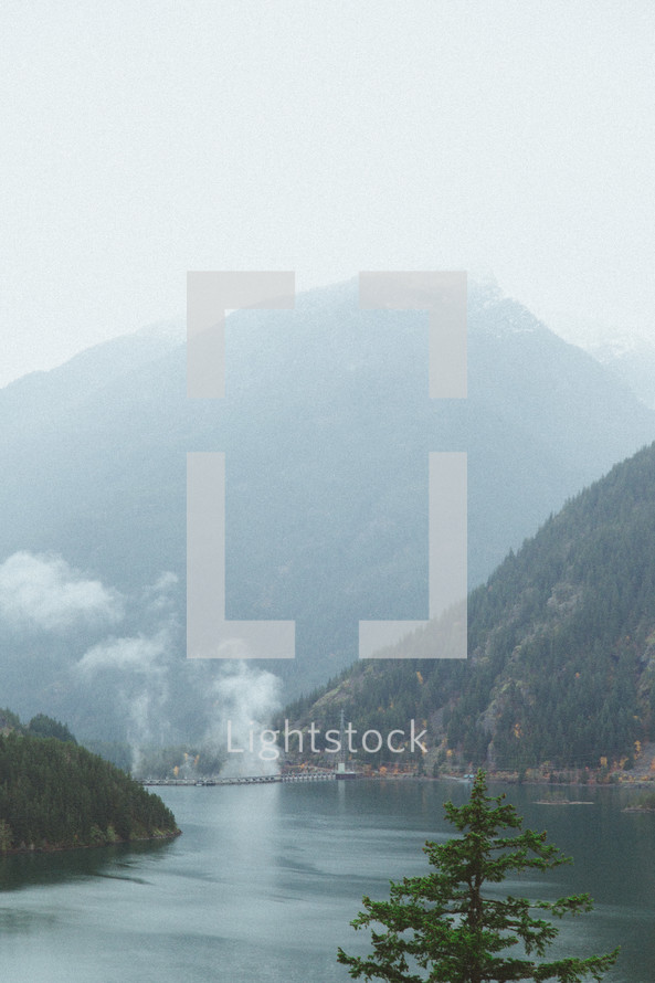 fog over mountains and lake 
