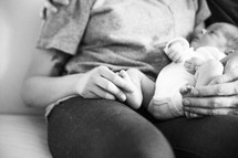 a mother holding her newborn