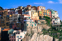 colorful houses and buildings on a cliff in Italy