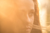 profile of a woman glowing in the sunlight 