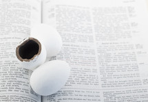 candy eggs on the pages of a Bible 