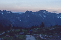 a man hiking on a trail in Mount Rainier