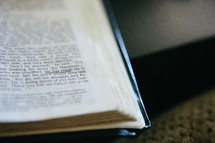 Open bible with scripture underlined "He is Risen"