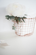 flowers in a wire basket 