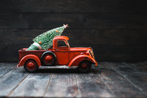 vintage red truck with Christmas tree 
