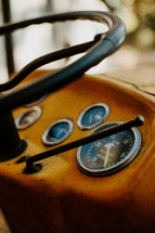 Close up of an old tractor steering wheel.