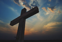 silhouette of a cross at sunrise 