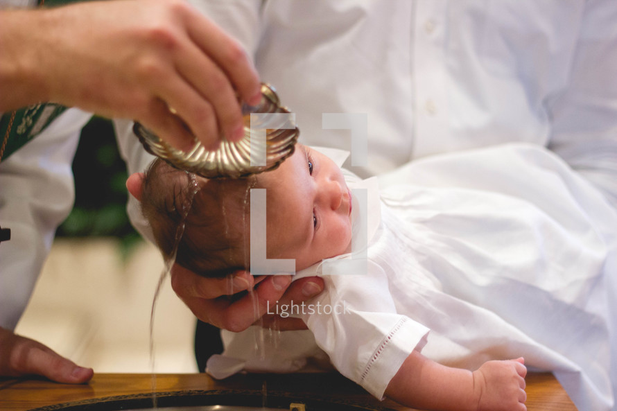 a baby being baptized 