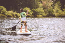 paddling a paddle board 