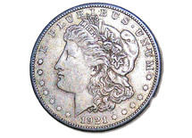 A 1921 Morgan Silver Dollar minted in 1921. It is rare to find these silver coins except among collectors but silver and gold are the currency that we set our currency standard that we use for exchange currency, savings and buying power  in today's economy. Silver and Gold were often mentioned in the bible as currency and things of lasting value from biblical times to today's marketplace. 