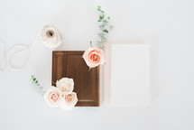 wood tray, twine, roses, and stationary 