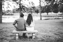 couple sitting together on a bench 