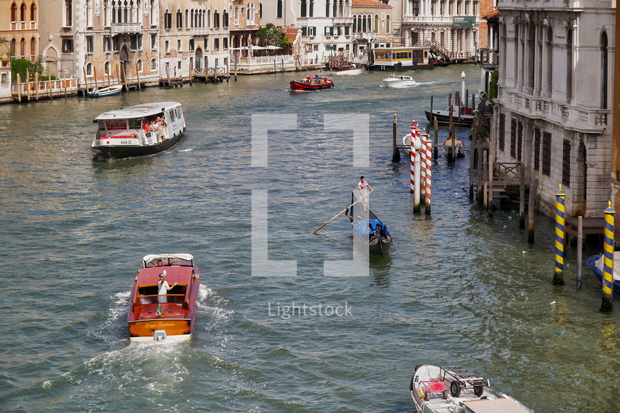 boats and gondolas on the canal in Venice 