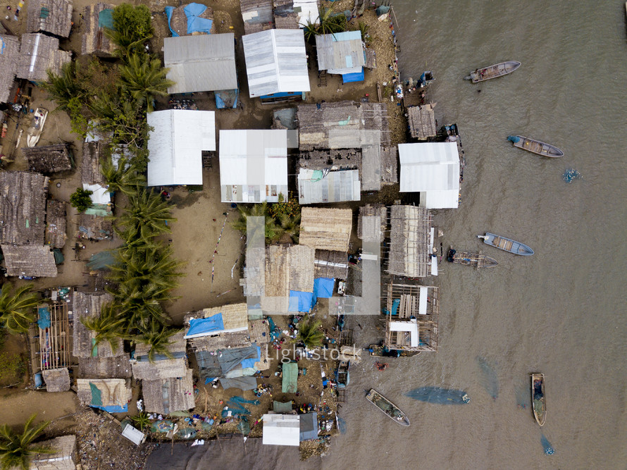 aerial view over a coastal village community 