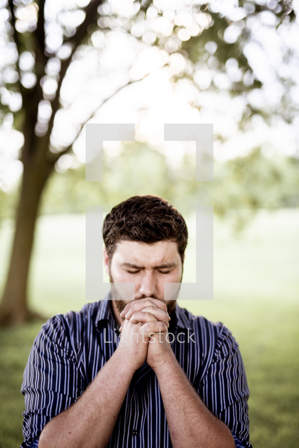 man with praying hands 