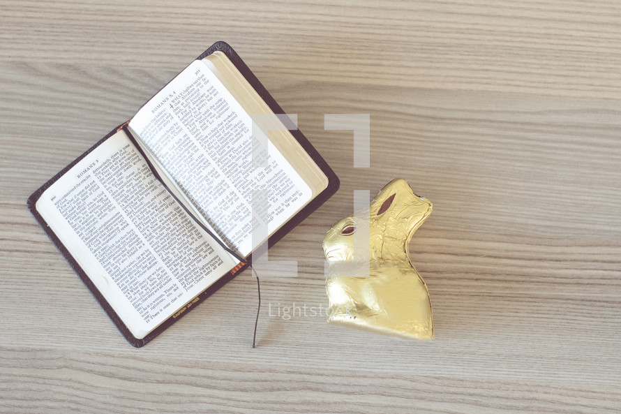 candy Easter bunny and pages of a Bible 