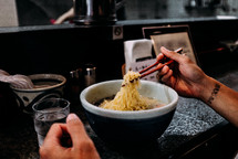 woman eating noodles in Japan 