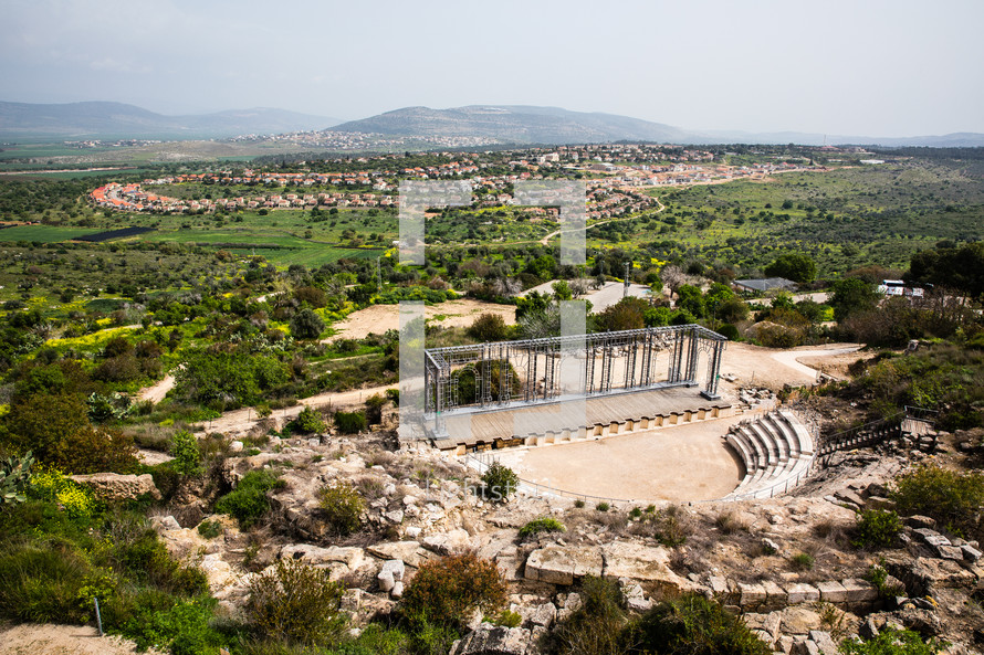 ancient ruins in the holy land and view of modern day suburbs 