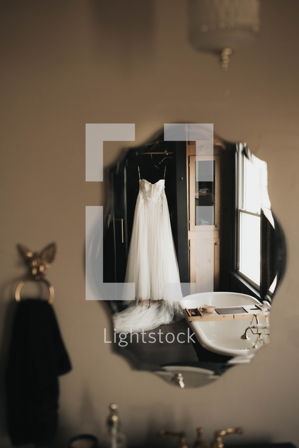 a wedding dress in a mirror