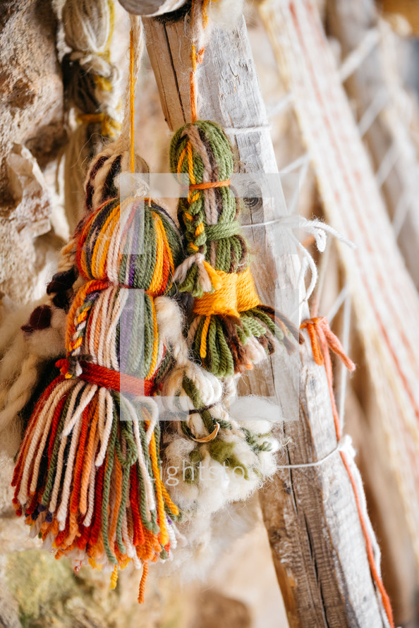 hanging tassels of yarn 